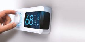 A close-up of a thermostat set to 68 degrees