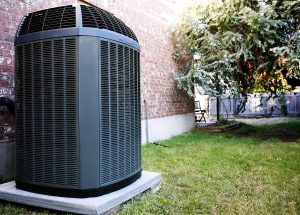 Large, energy-efficient air conditioning unit in backyard