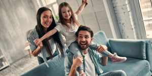 Young family smiling in home