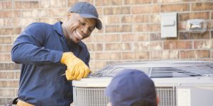 Technician working on an air conditioning unit